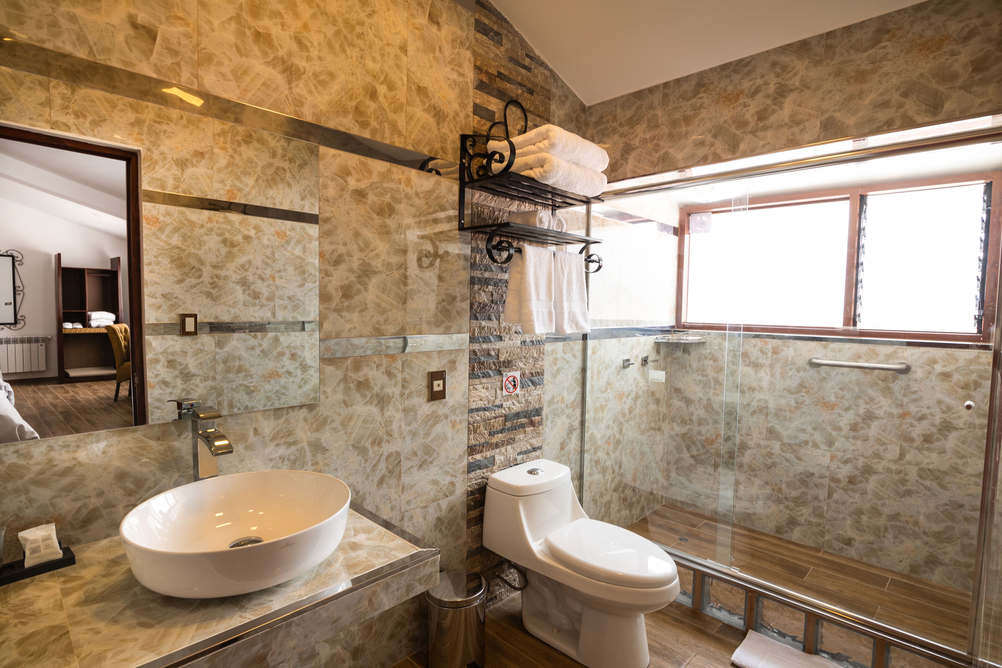 Shower, rainfall showerhead, hair dryer, towels