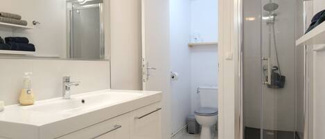 Shower, hair dryer, towels, soap