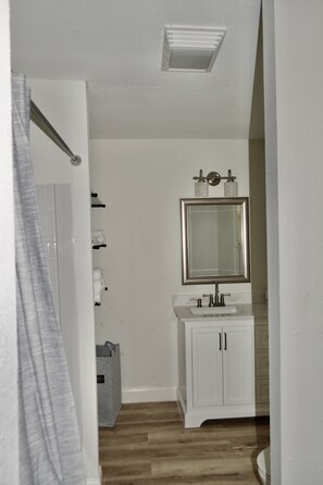 Combined shower/tub, hair dryer, towels, soap