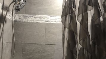 Bathtub, hair dryer, towels, soap