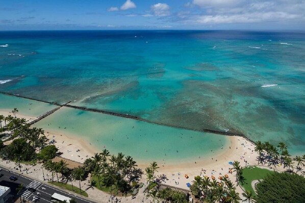 Enjoy breathtaking views of the turquoise waters and sandy beach from our resort's pier.