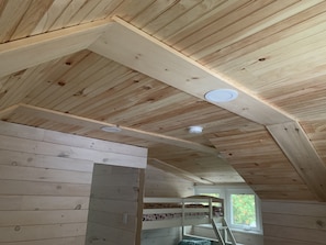 Cozy family room with a bunk bed and multi-level sleeping arrangement.