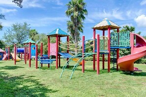 A playground with various play structures including slides, swings, and climbing areas. - Inspiring view, relaxing ambience, family favorite (Destin)