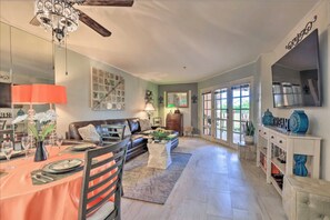 Cozy living space with a fireplace, dining area, and comfortable seating.