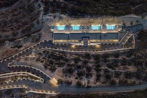 An aerial view of a modern building with multiple swimming pools, surrounded by a landscaped area with pathways. - Brand new villa in Falasarna★Seaview★Infinity pool (Phalasarna)
