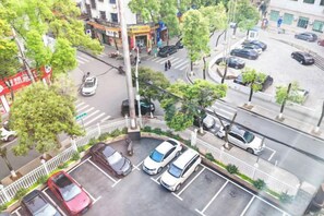 A multi-level parking structure with several cars parked. - Yizhang Fuhao Hotel (Yizhang)