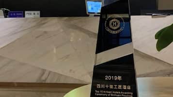 A hotel award plaque from 2019, indicating a top award for Sichuan Province.