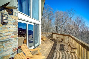 Relax on the spacious deck with comfortable seating and a seamless transition to the interior.