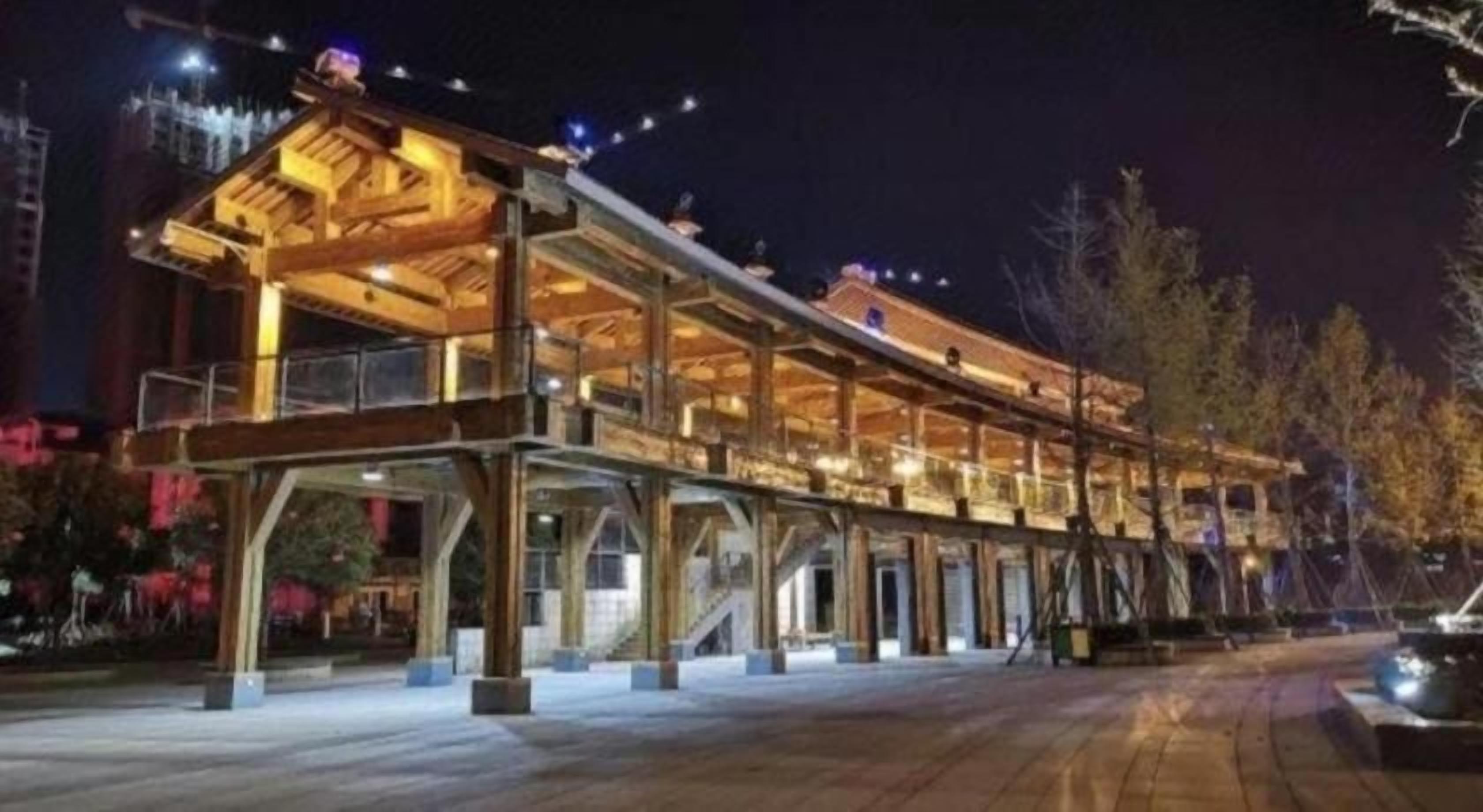 A multi-story building with a covered outdoor area, possibly a hotel or resort.