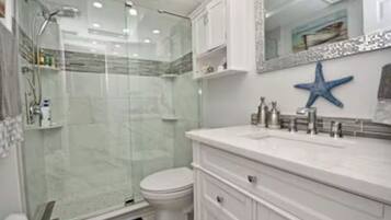 Shower, hair dryer, towels, soap