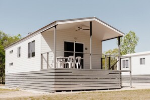 A single-story mobile home with a covered porch and a small patio area. - Discovery Parks - Katherine River (Cossack)