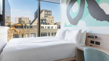 One of a Kind | Premium bedding, down comforters, pillowtop beds, in-room safe