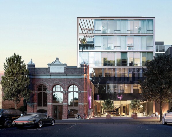 A modern building with a brick facade and large windows.