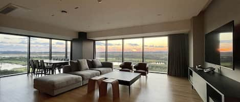 Panoramic Condo | Living area | 55-inch Smart TV with cable channels, TV, heated floors