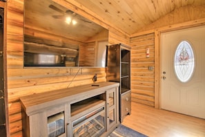 Cozy space with a cabinet and modern convenience.