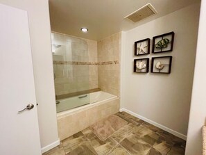 Combined shower/tub, hair dryer, towels, soap