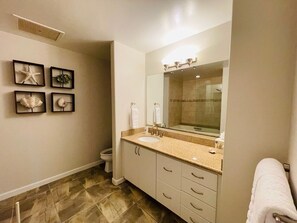 Combined shower/bathtub, hair dryer, towels, soap