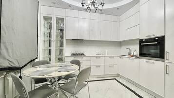 City Apartment | Private kitchen | Full-sized fridge, stovetop, electric kettle, toaster