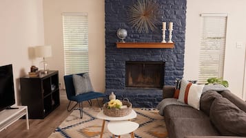 TV, fireplace, books, stereo