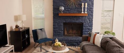 TV, fireplace, books, stereo