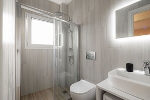 Shower, towels, soap, toilet paper