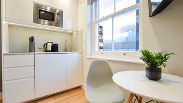 Standard Studio Apartment | Private kitchen | Mini-fridge, microwave, stovetop, electric kettle