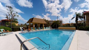 A swimming pool with lounge chairs and a covered pavilion. - Prime Location I Free Beach Access Directly Across The Street!!! (Marco Island)