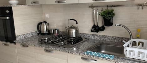 Microwave, coffee/tea maker, cookware/dishes/utensils