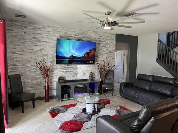 Smart TV, fireplace, table football, books
