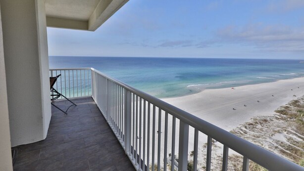 A balcony with a view of a beach and ocean. - 11th Floor 4 BR 3BA End unit in Tower 1 at the Majestic!! (Panama City Beach)