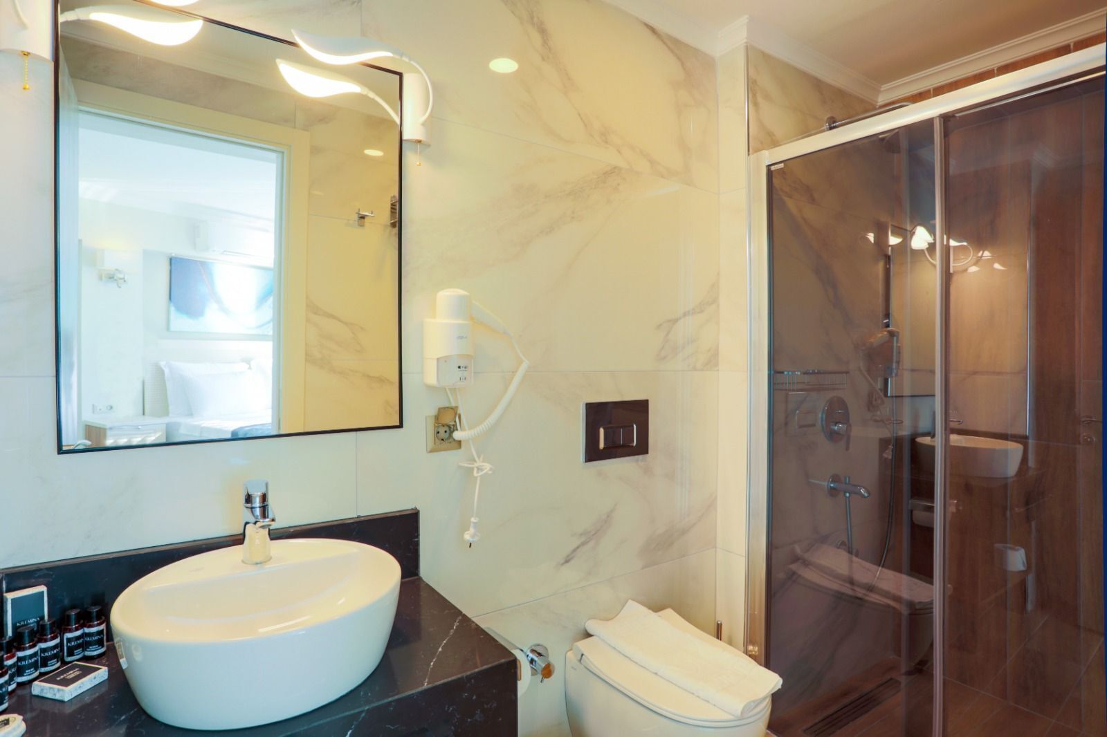 shower, hair dryer, bathrobes, slippers