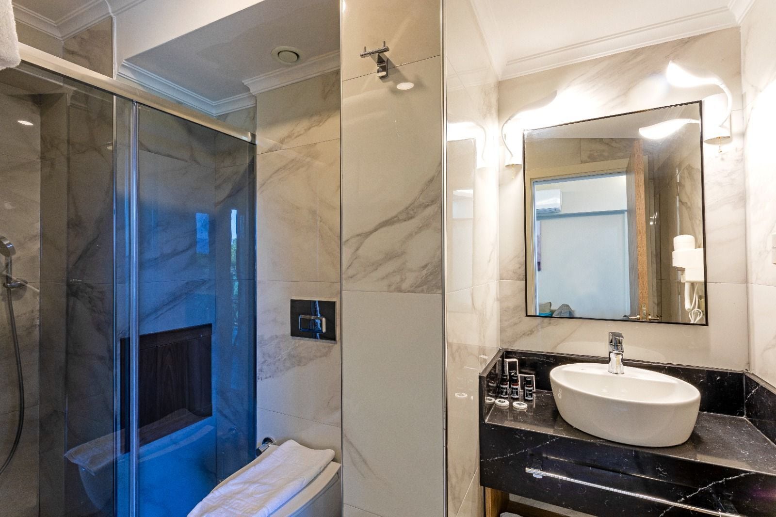 shower, hair dryer, bathrobes, slippers