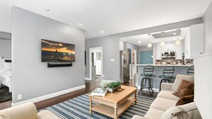 A modern living room with a sofa, coffee table, and a painting on the wall. - Condo on property at LaCosta Golf Resort & Spa 689 (Carlsbad)