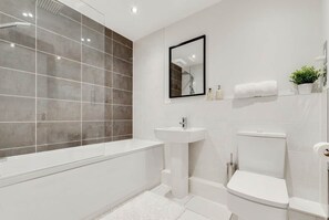 Bathtub, hair dryer, towels