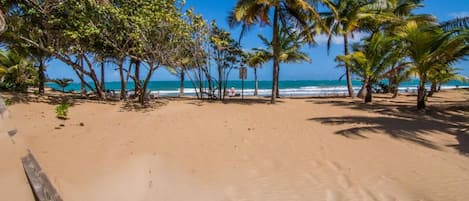 On the beach, sun loungers, beach towels