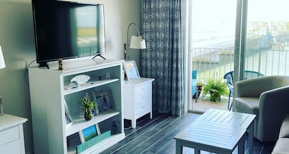 A pristine condo on the bay that comes with beautiful sunsets.