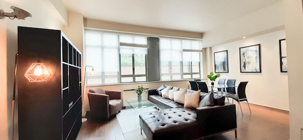 Apartment | Living area | 30-inch TV with cable channels