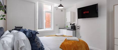 1 bedroom, desk, iron/ironing board, travel crib