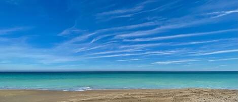 On the beach, sun-loungers, beach towels