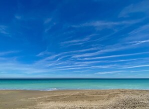 On the beach, sun-loungers, beach towels