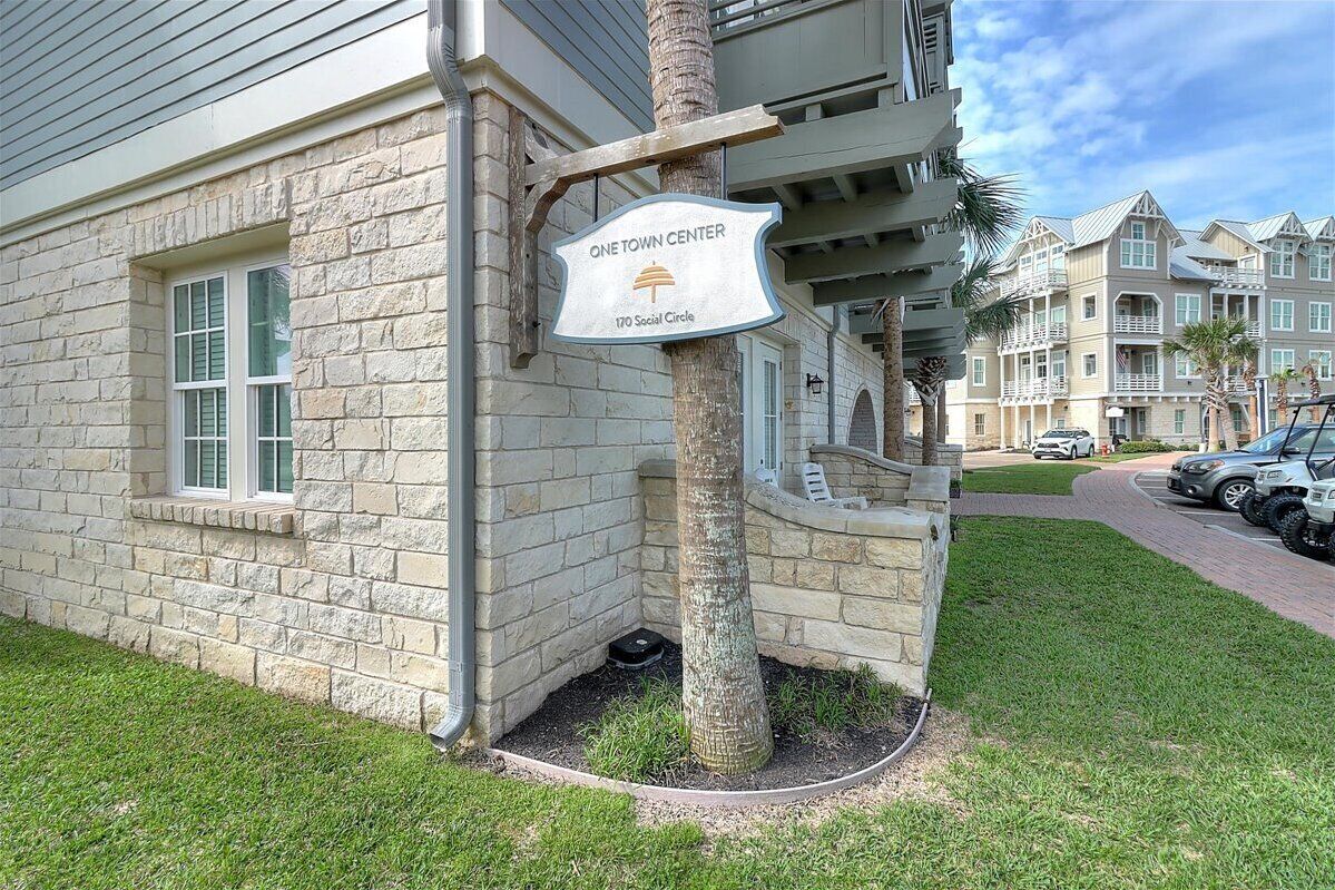 A stone building with a sign indicating 'One Town Center 170 Social Circle'.
