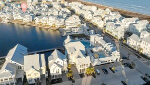 A coastal residential area with houses, a marina, and a large swimming pool. - Keepin' It Reel 234 LAK (Port Aransas)