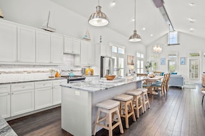 Enjoy meals in the kitchen with a central island and dining area.