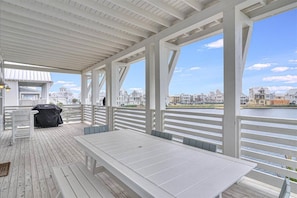 Enjoy al fresco dining with a scenic view of the waterfront from this outdoor deck.