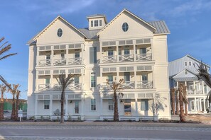 A multi-story hotel with balconies, a flat roof, and a light-colored exterior. - The Lighthouse 328 COA (Port Aransas)