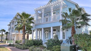 A two-story building with a balcony and a covered porch. - Sea Ya' Soon 130 ST (Port Aransas)