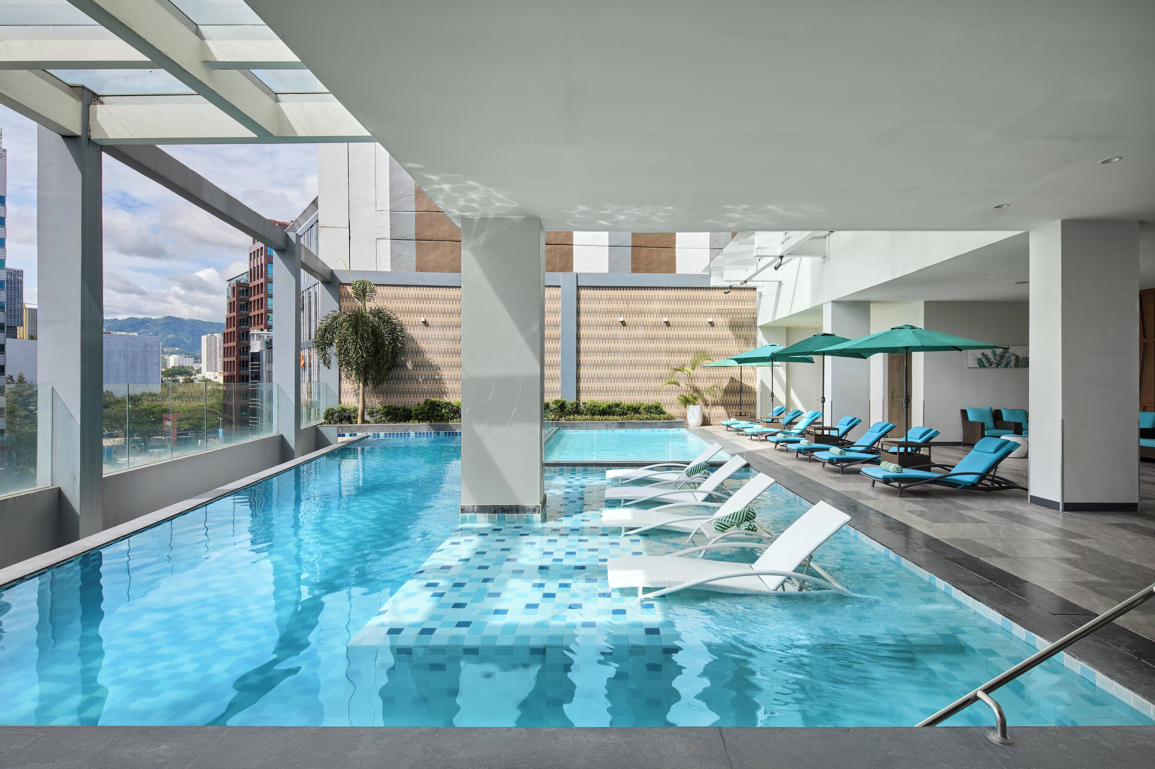 Outdoor pool, open 6:00 AM to 8:00 PM, pool umbrellas, pool loungers