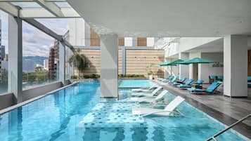 Outdoor pool, open 6:00 AM to 8:00 PM, pool umbrellas, pool loungers