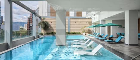 Outdoor pool, open 6:00 AM to 8:00 PM, pool umbrellas, pool loungers