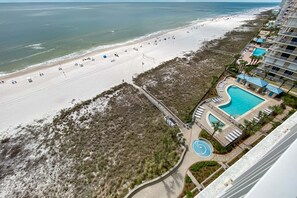 A resort with a beach, a swimming pool, and a boardwalk. - Bluewater 1001- Family Fun In The Sun!!! (Orange Beach)